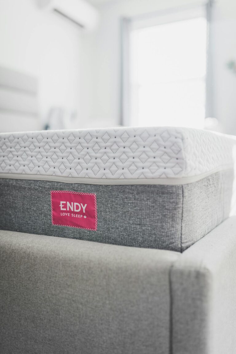 Close-up photo of a comfy Endy mattress on a bed, highlighting texture and design.